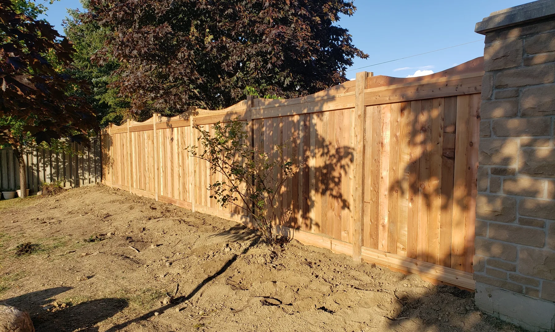 Engineered cedar sound-barrier fence with full privacy