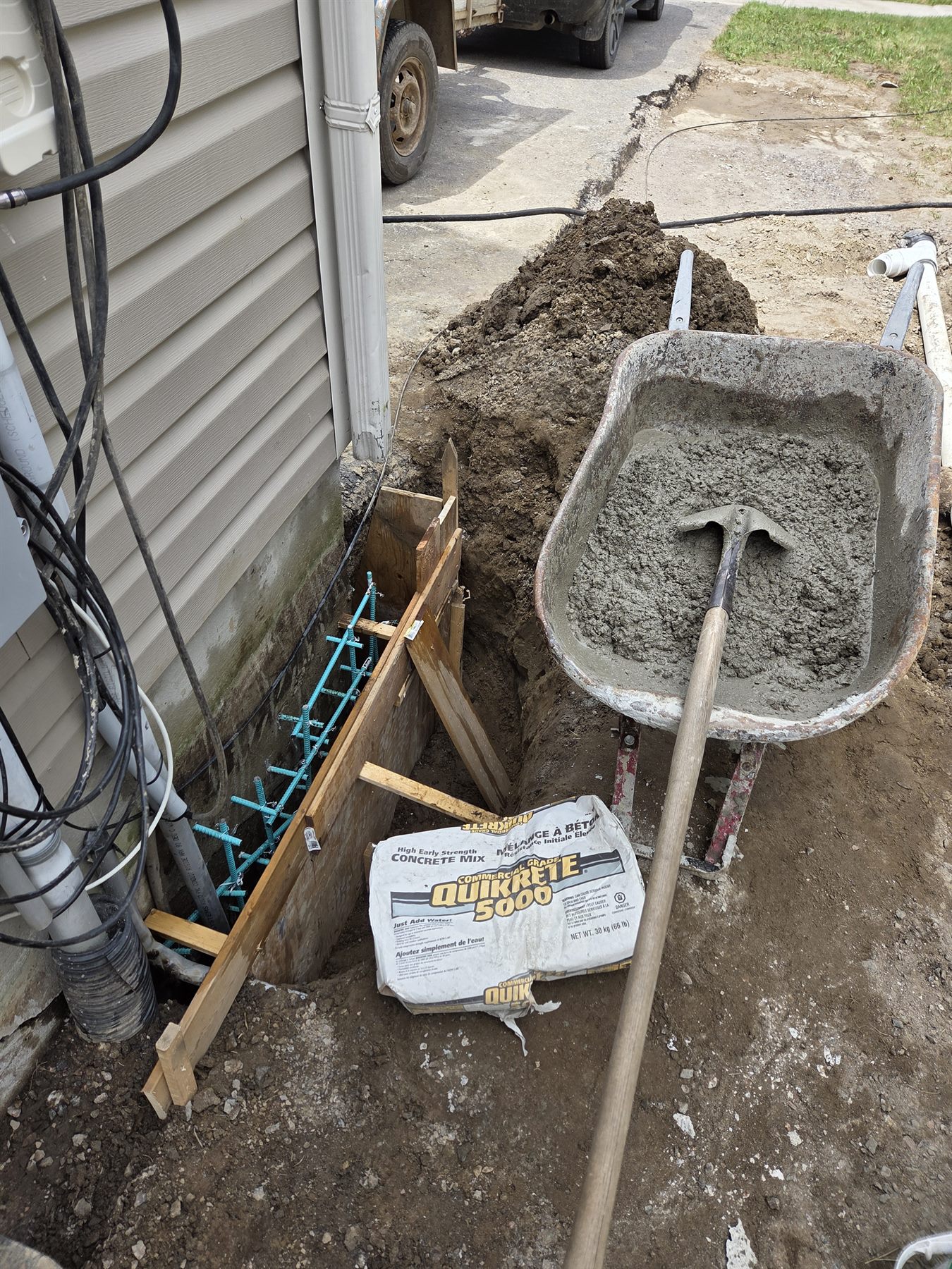 Concrete preparation beside the foundation repair work area