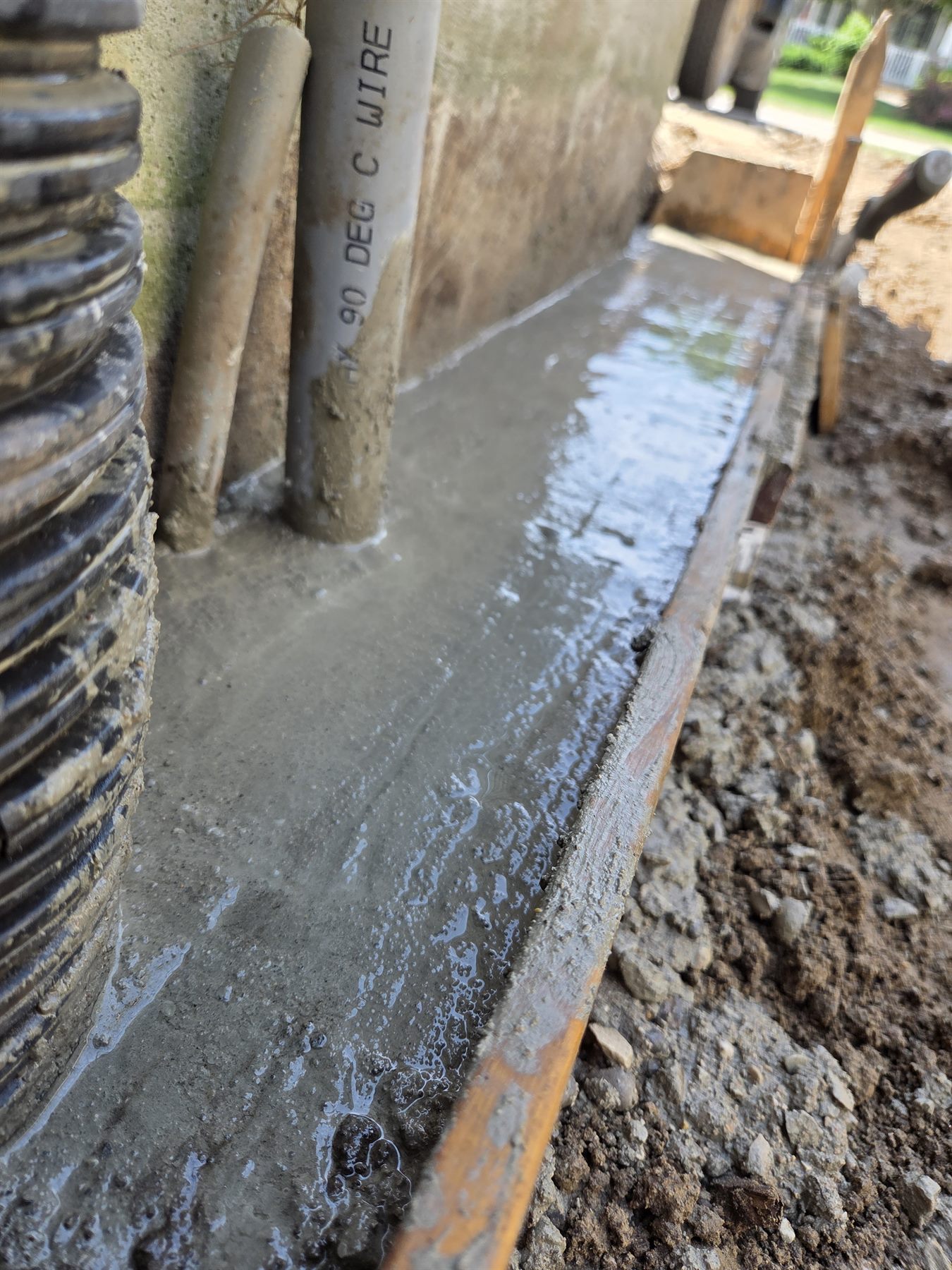 New concrete footing completed beside the existing foundation