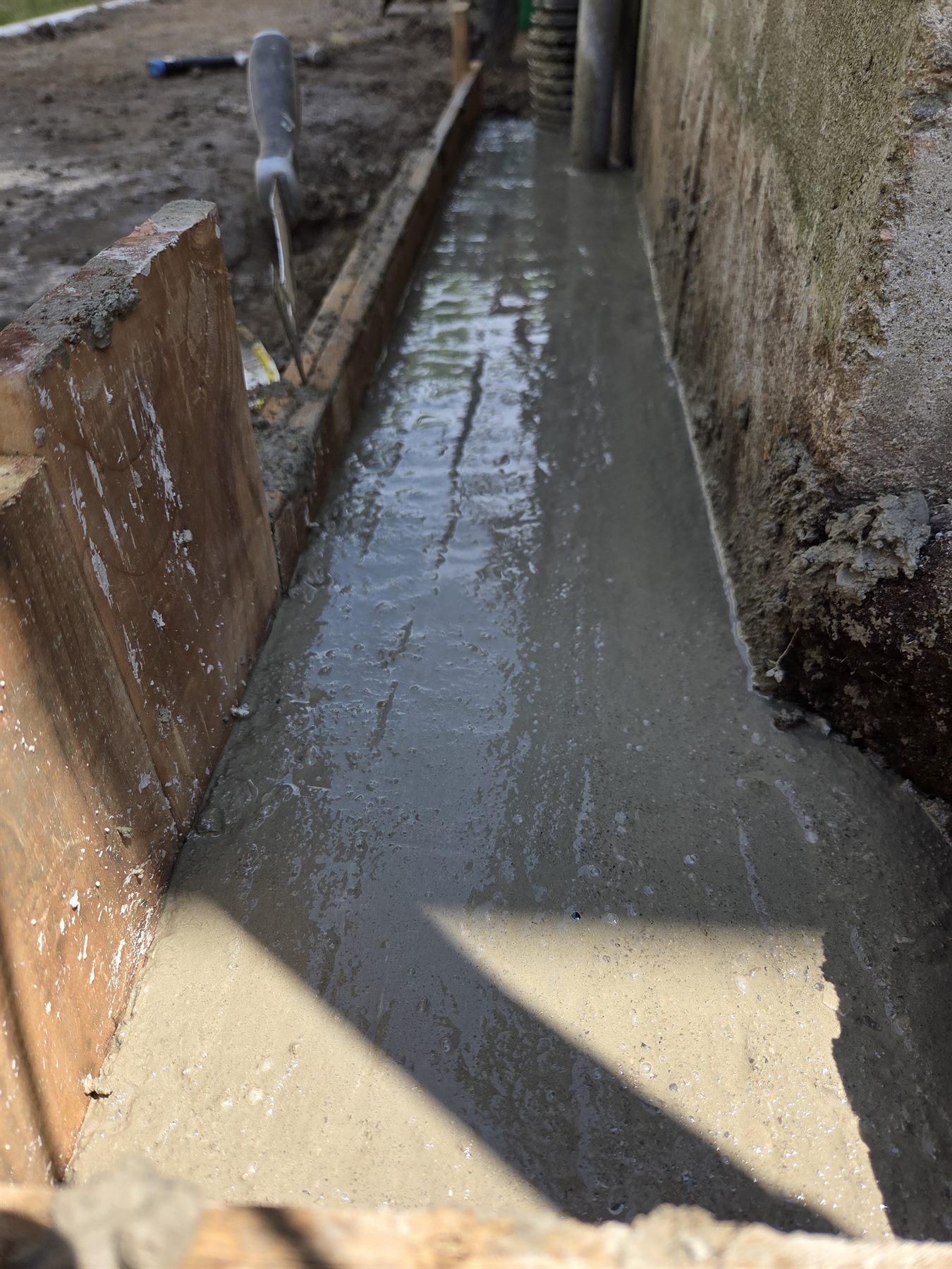 Detailed view of the completed concrete footing repair
