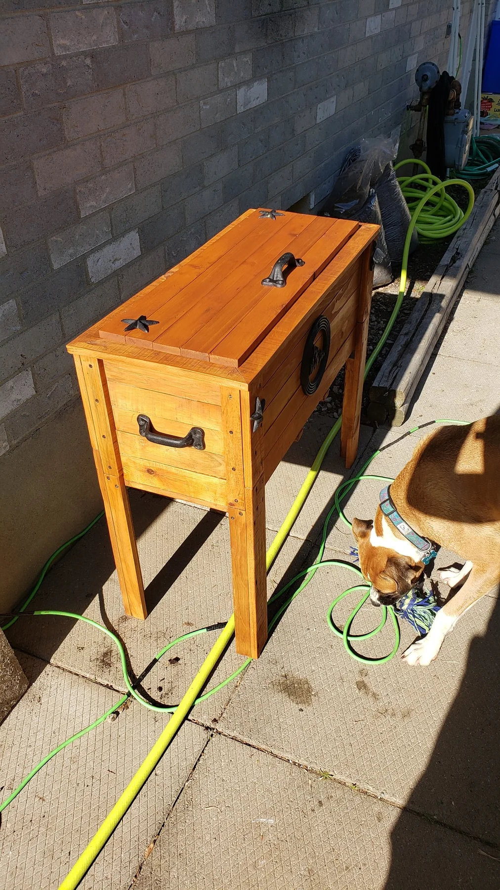 Completed refinished cedar planter in its outdoor setting
