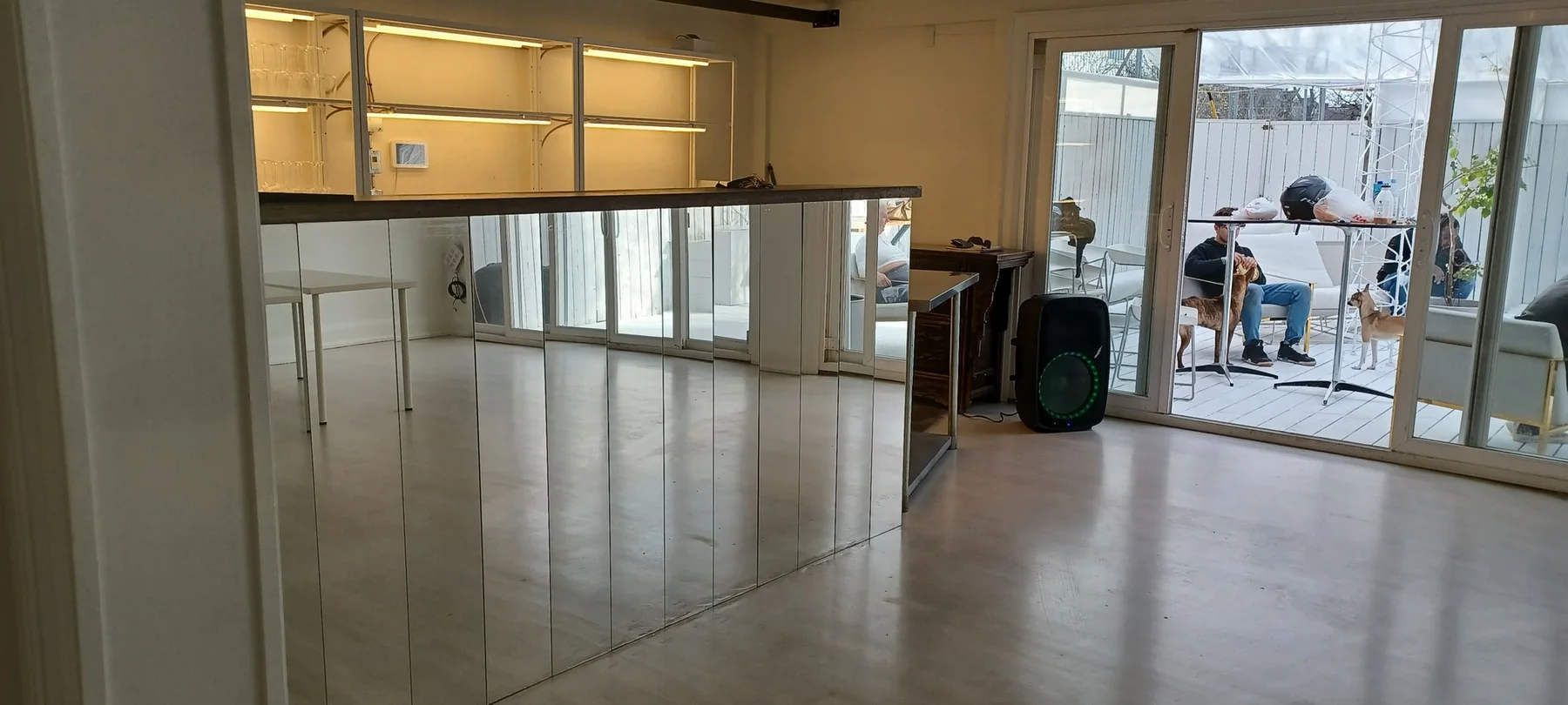 Completed open event-space floor with a smooth reflective finish