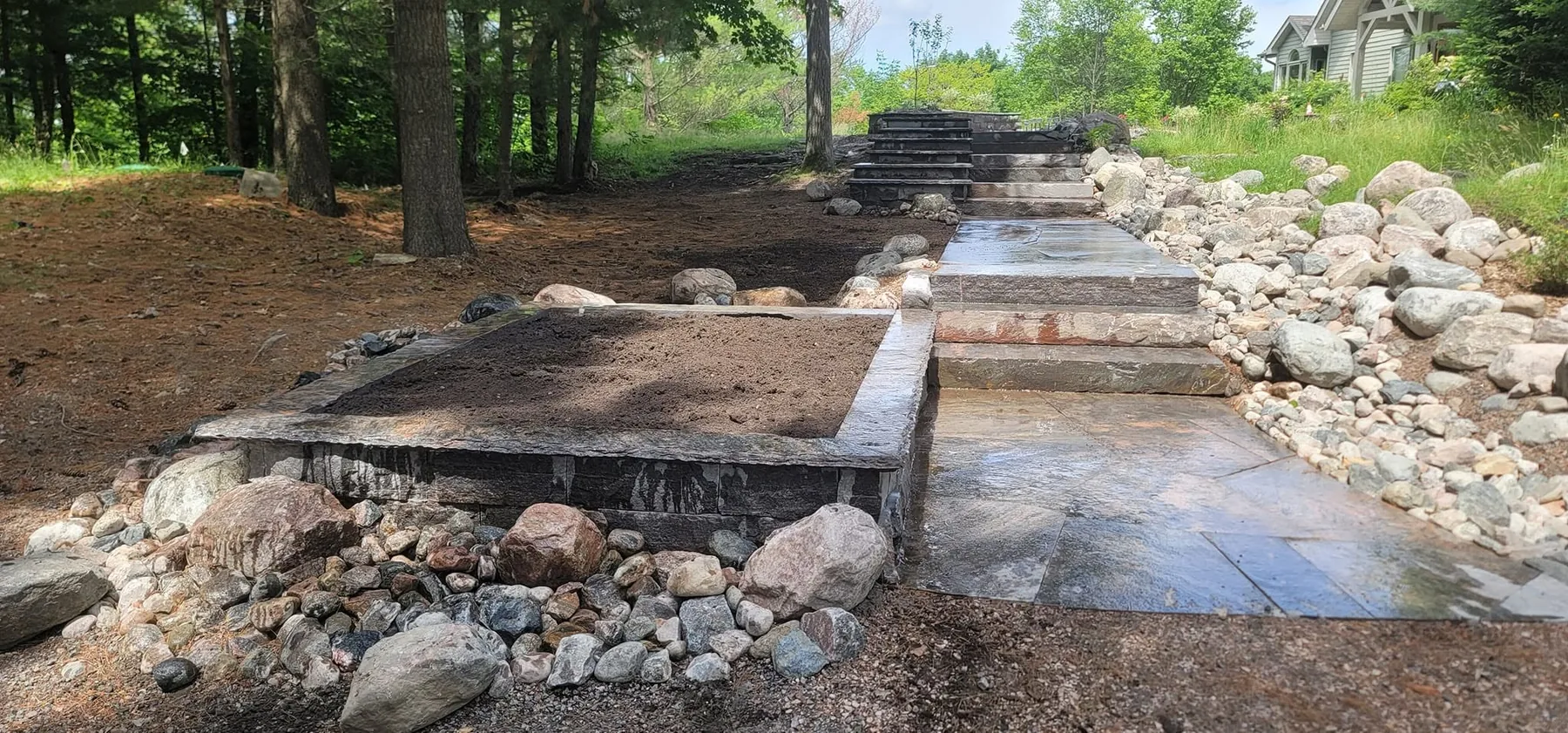 Granite entry steps and planter walls