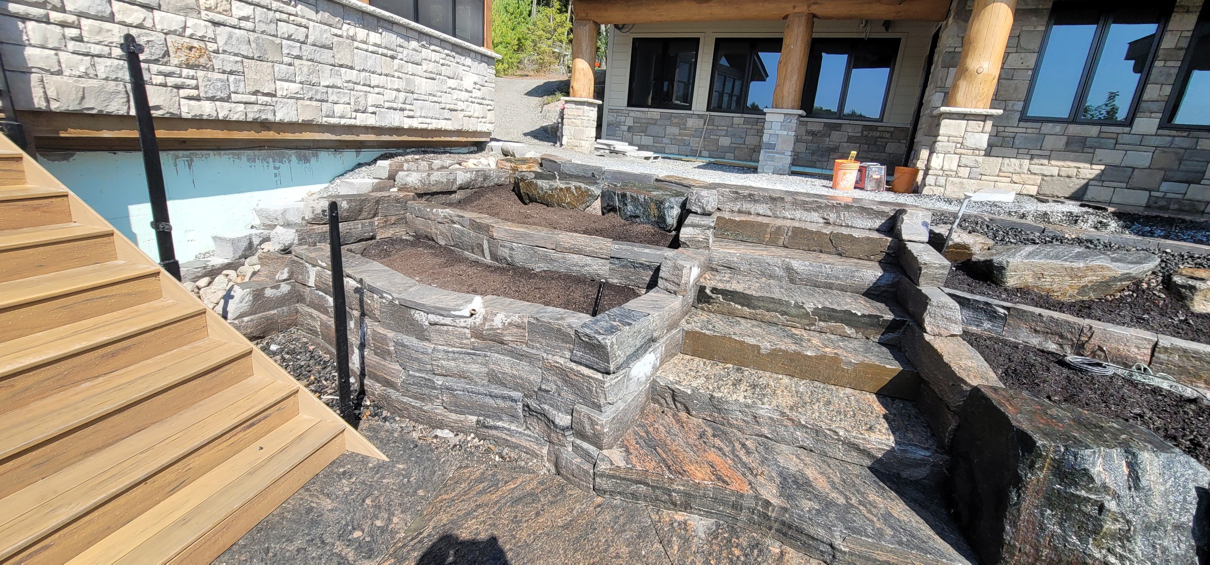 Finished front planter terrace and stone approach