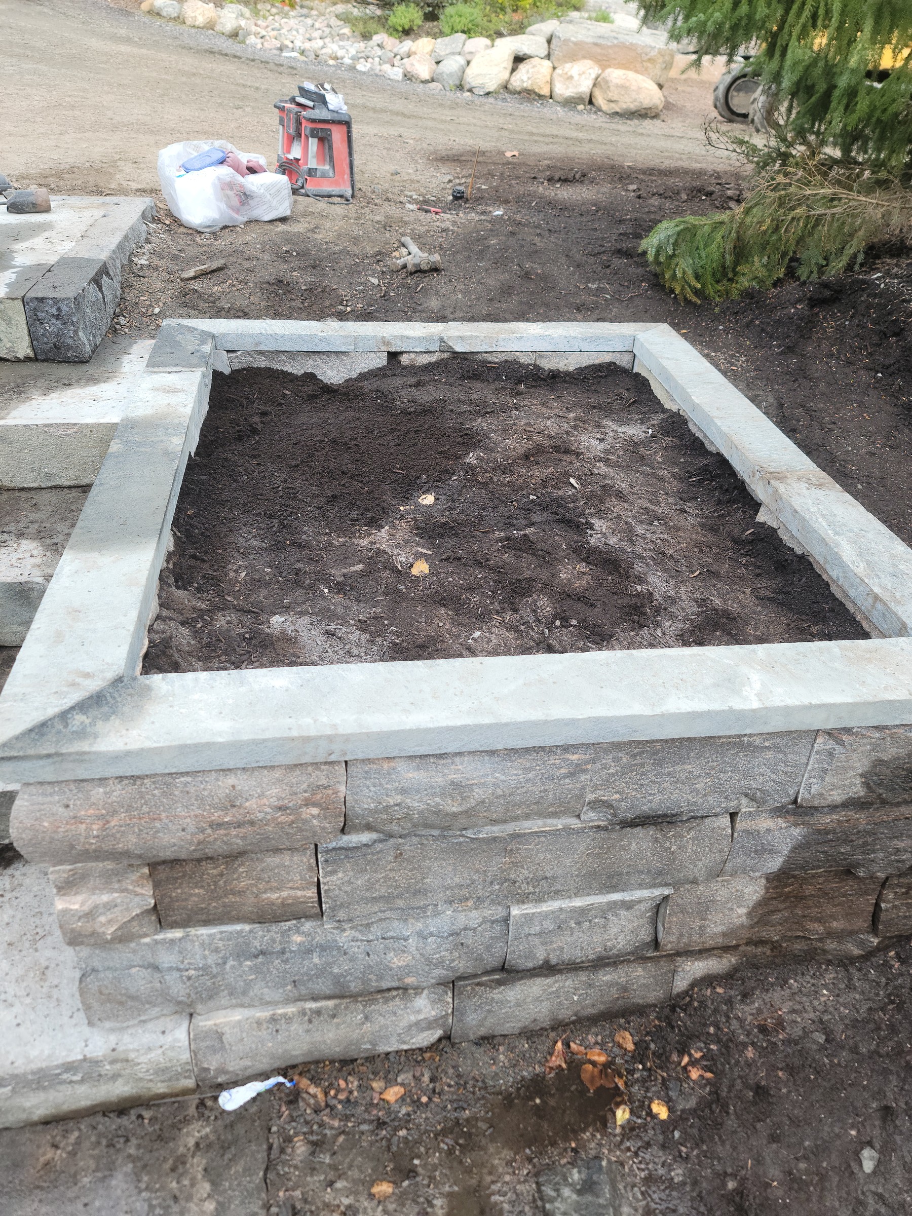 Front stair granite planter wall during construction