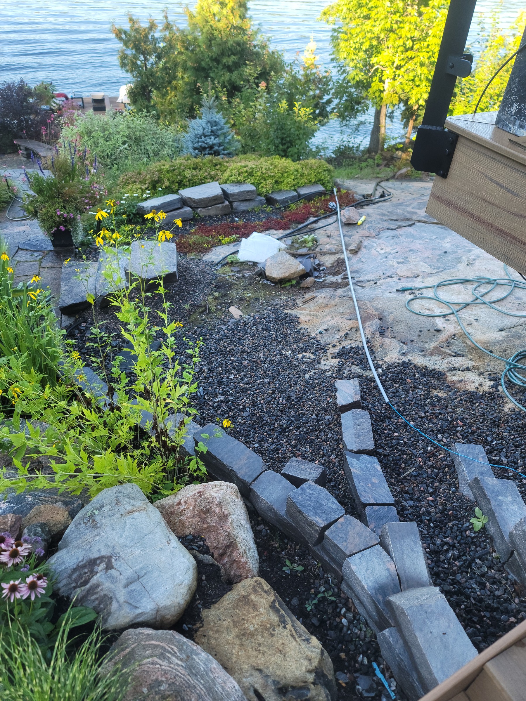 Near-completion flagstone path and steps set into the natural grade