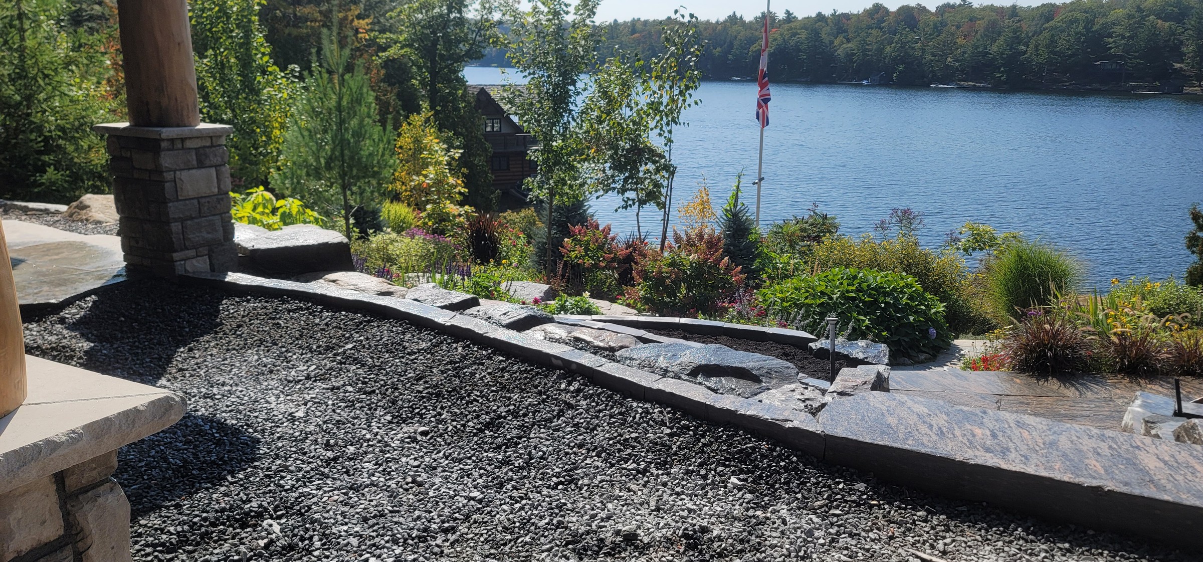 Completed lakeside stone edging and garden transition