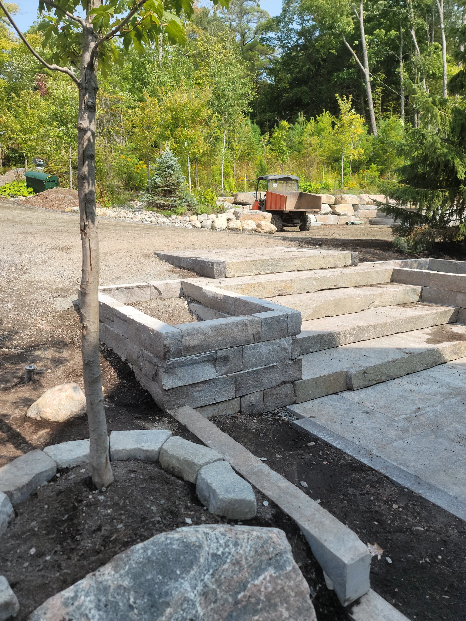 Granite front entry planter and stair construction in progress