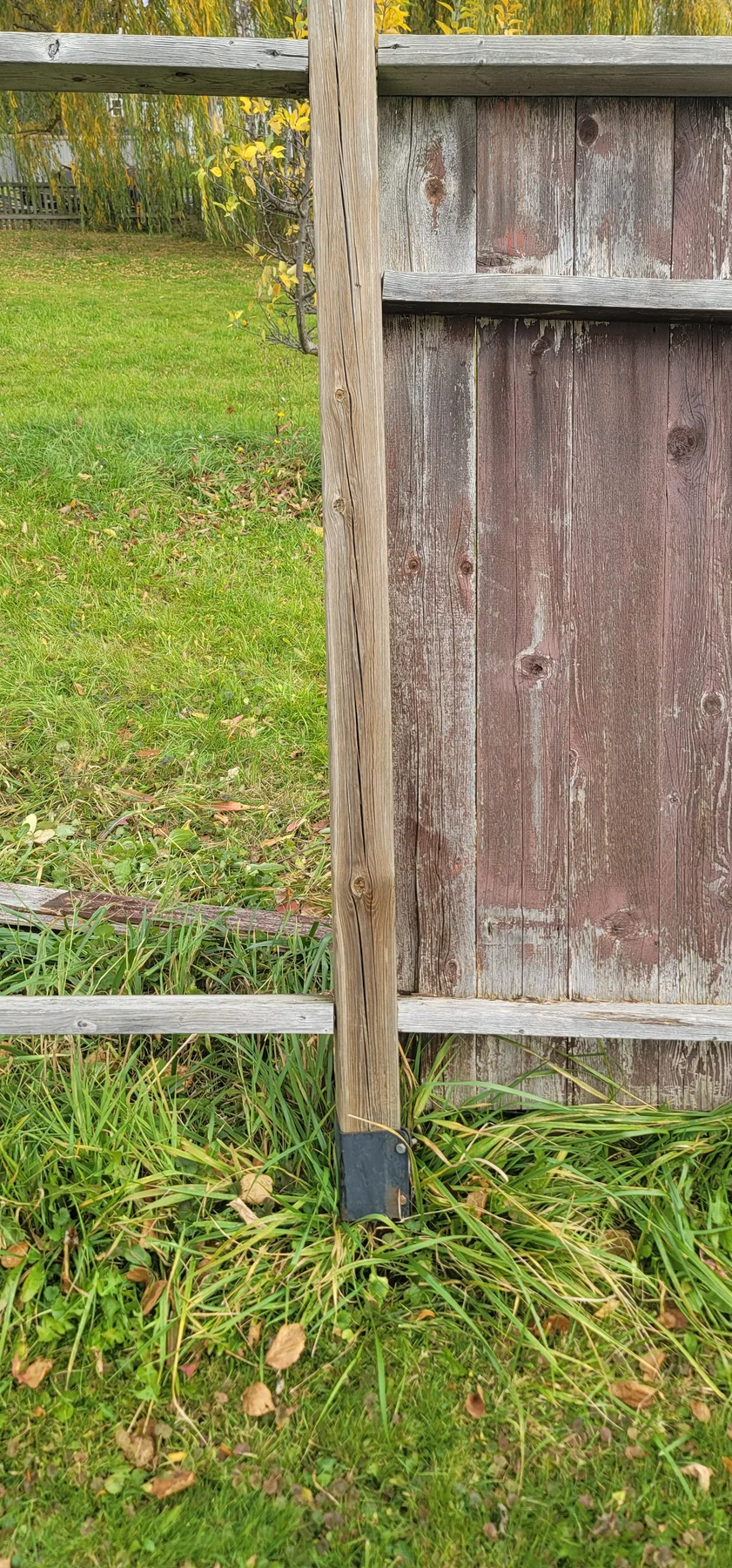 Aged fence section before long-run perimeter replacement